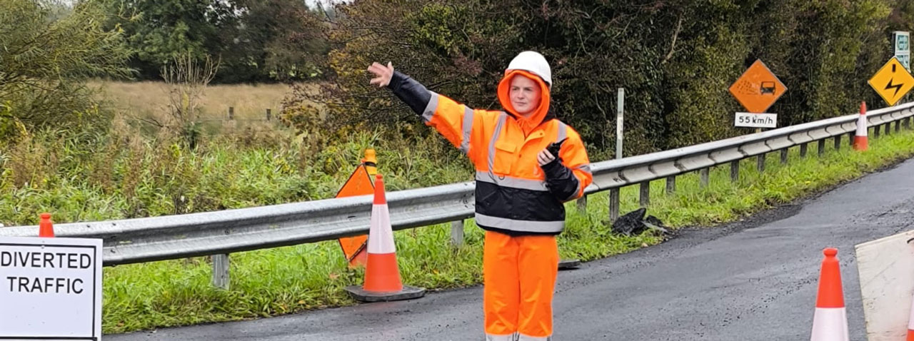 Construction site traffic marshal managing traffic