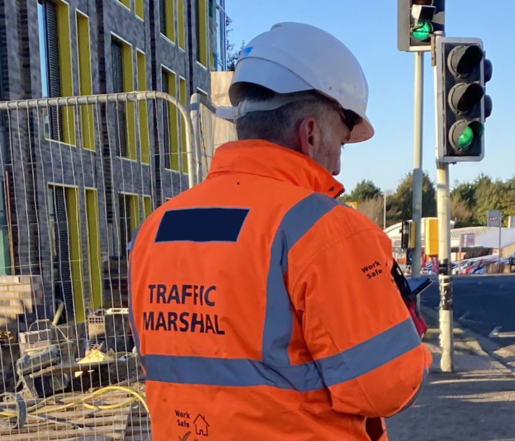Traffic marshal managing traffic at a construction site